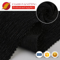 Polyéster negro suave de poliéster negro textil triturado de terciopelo spandex patio de tela plisado